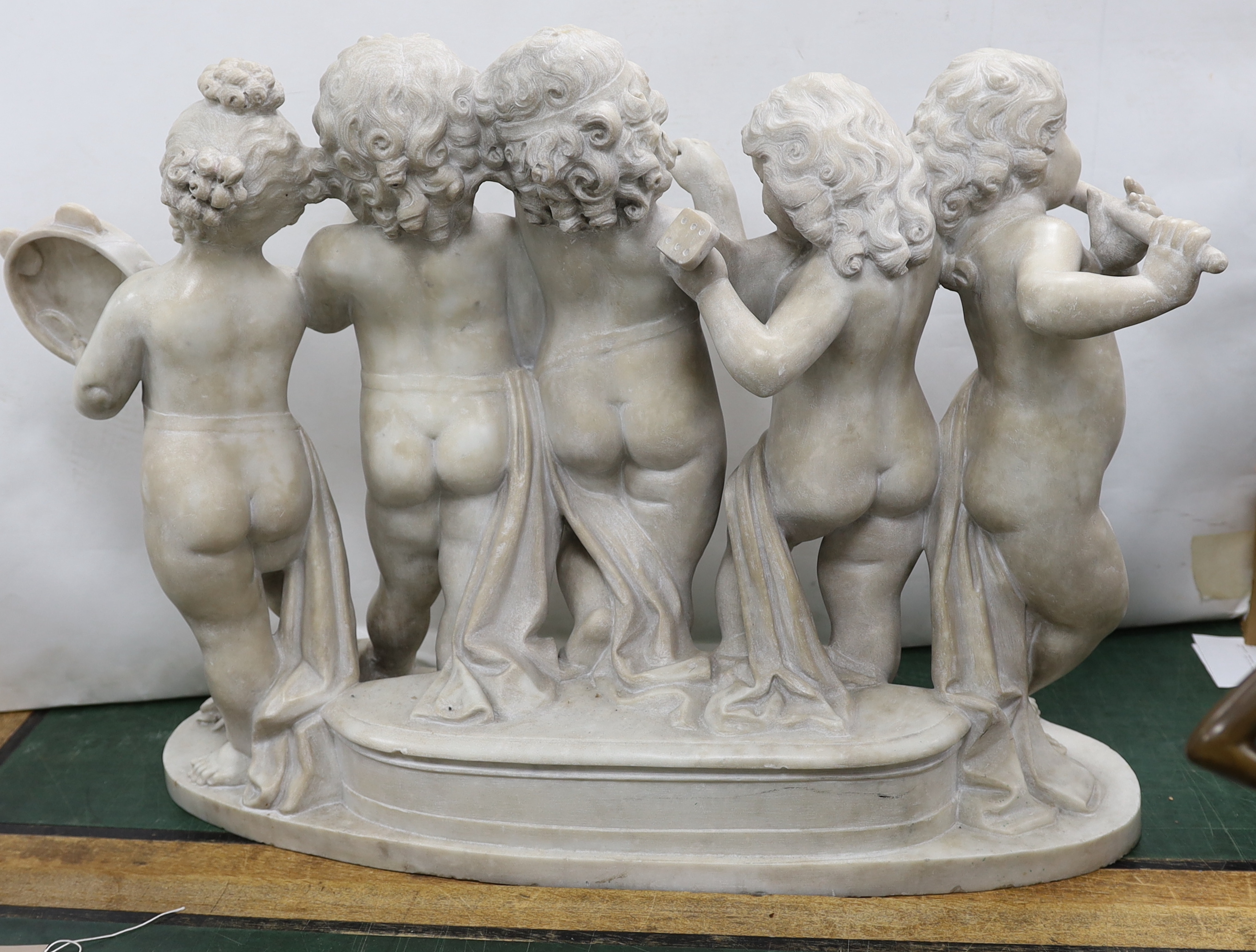 After the Ferdinando Vichi Gallery. An Italian white Carrara marble group 'Musica', Please note this lot attracts an additional import tax of 5% on the hammer price